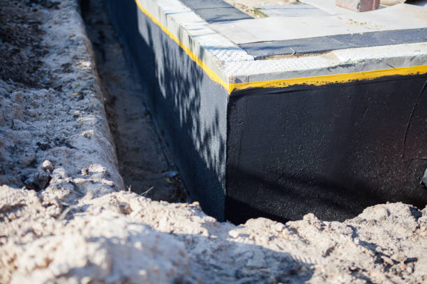 Professional Waterproofing technician working in Woodstock, VA